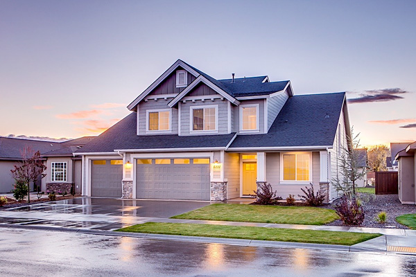 a house glowing with light at sunset