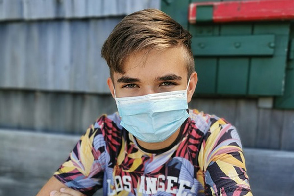 young person wearing covid mask