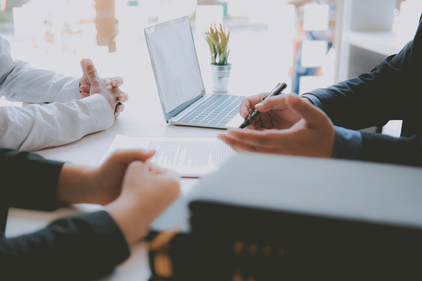 image with business people signing documents