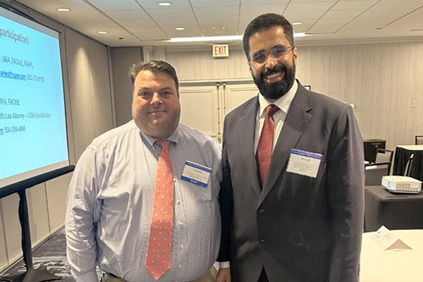 A picture of Conrad Meyer, JD, MHA, FACHE, with Ahmad Alshalan, BDS, MHA.